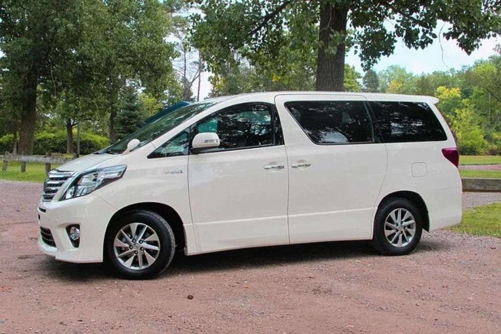 services-04 silver-hybrid-minivan-countryside-park